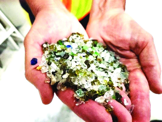 Handful of glass for recycling