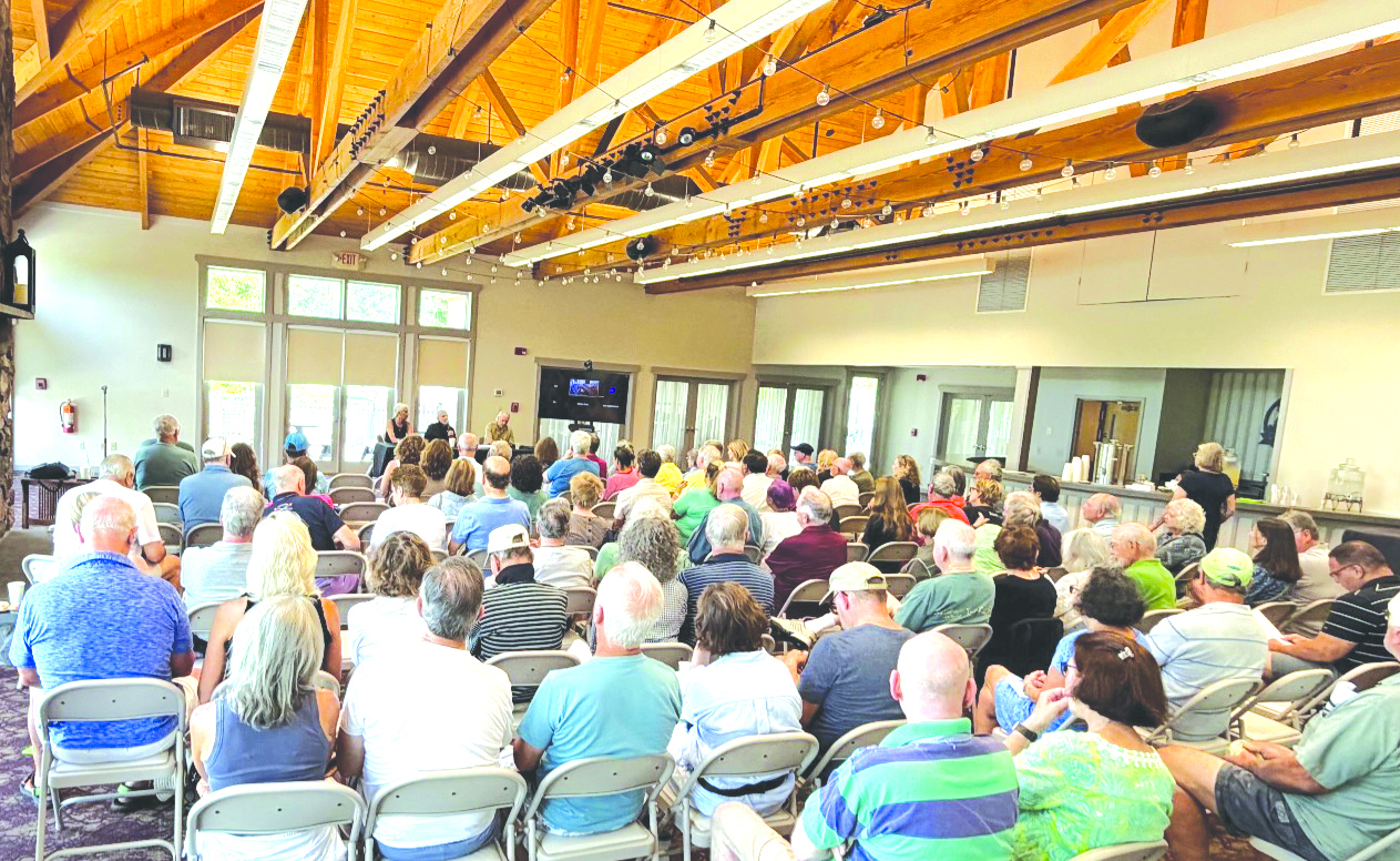 A capacity crowd listens to the Rosens talk about their views and experiences